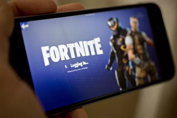 Fortnite wird schließlich in den USA zu iPhones zurückkehren, fast fünf Jahre nach dem Ziehen des Spiels. Fotograf: Andrew Harrer/Bloomberg über Getty Images.